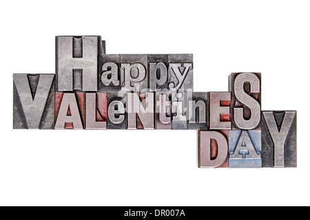 Glücklich Valentinstag Text in alten Metall Buchdruck-Blöcken mit gemischten Schriftart, isoliert auf einem weißen Hintergrund. Stockfoto