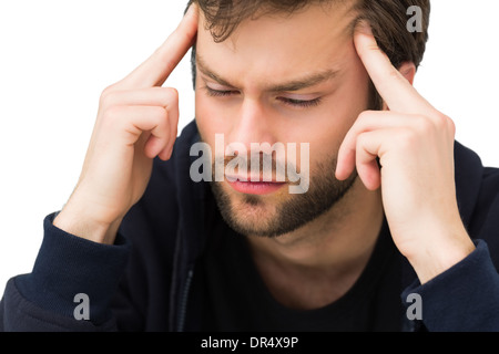 Ein hübscher junger Mann mit Kopfschmerzen in Nahaufnahme Stockfoto