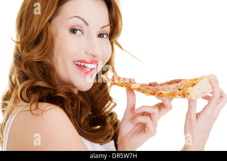 Glückliche Frau Pizza essen. Auf weißem Hintergrund. Stockfoto