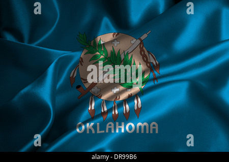 Oklahoma-Flagge auf seidige Textur. Stockfoto