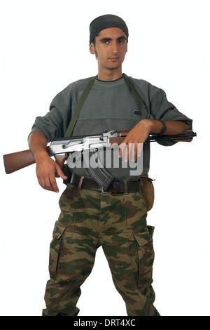 Mann in Camouflage mit Pistole. Stockfoto