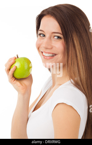 Schöne junge Frau, die einen grünen Apfel, isoliert auf weiss Essen Stockfoto