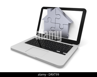 Haus-Symbol gemacht von vier silbernen Puzzleteile ragte aus Laptop-Bildschirm Stockfoto