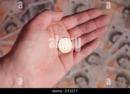 Zwei Pence Münze in die Hand eines Mannes. Stockfoto