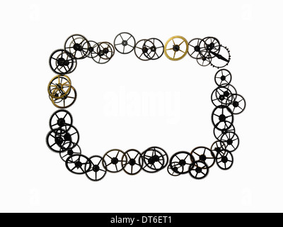 Uhr Zahnräder, kleine Genauigkeit gemacht Zahnräder in einem rechteckigen Rahmenform angeordnet. Die beweglichen Teile einer Uhr. Stockfoto