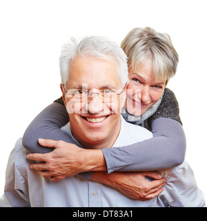 Glücklich älterer Mann lächelnd senior Frau Huckepack tragen Stockfoto