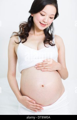 Glücklich schwanger Frau Stockfoto