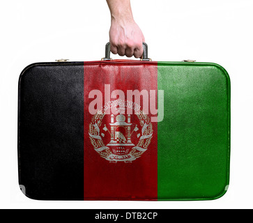 Touristischen Hand mit Vintage-Leder Reisetasche mit Flagge von Afghanistan Stockfoto