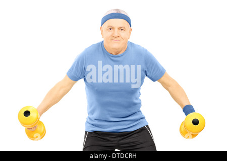 Reifer Mann in der Sportswear mit Hanteln trainieren Stockfoto