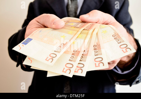 Geschäftsmann Betrieb Geld. Stockfoto