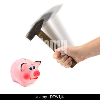Hand mit Hammer und Sparschwein Stockfoto