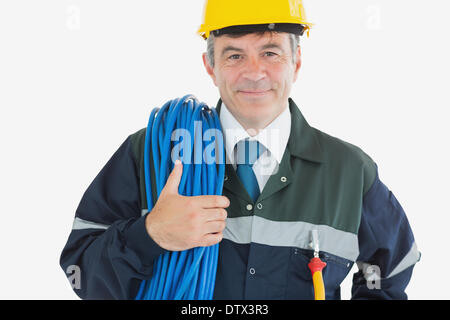 Zuversichtlich reifer Mann mit gerollten Draht Stockfoto