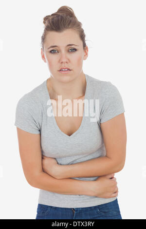 Junge Frau Magenschmerzen leiden Stockfoto