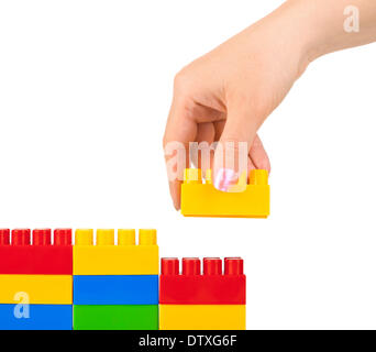 Hand und Spielzeug Wand Stockfoto