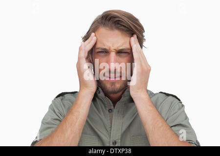 Mann mit Schmerzen von Kopfschmerzen Grimassieren Stockfoto