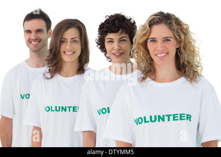 Vier Personen tragen freiwillige tshirt Stockfoto