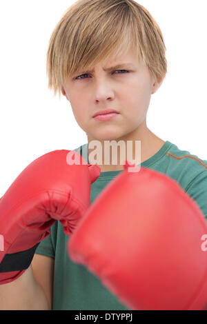 Blonde junge mit Boxhandschuhen Stockfoto