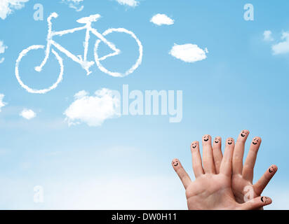 Glücklichen Smiley Finger Blick auf eine Fahrrad-Shapeed-Wolke Stockfoto