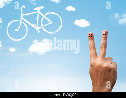 Glücklichen Smiley Finger Blick auf eine Fahrrad-Shapeed-Wolke Stockfoto