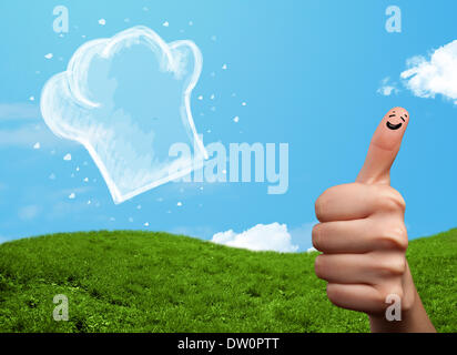 Glücklichen Smiley Gesicht Finger Blick auf Abbildung der Koch Hut Stockfoto
