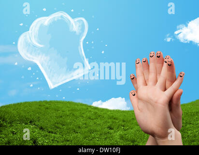 Glücklichen Smiley Gesicht Finger Blick auf Abbildung der Koch Hut Stockfoto