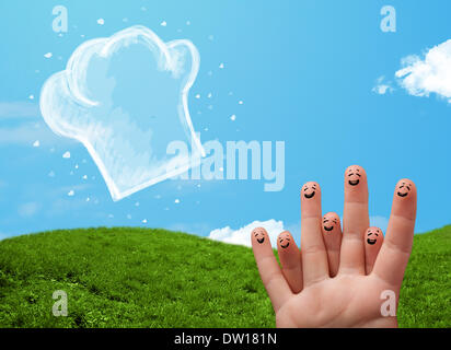 Glücklichen Smiley Gesicht Finger Blick auf Abbildung der Koch Hut Stockfoto