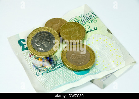Fünf-Pfund-Note und eins und zwei Münzen. Stockfoto