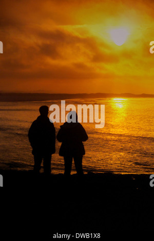 Sonnenuntergang über die Bucht von Budle, Northumberland Stockfoto