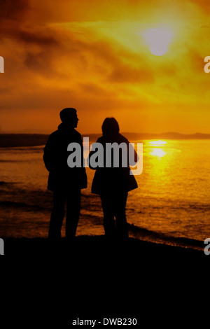 Sonnenuntergang über die Bucht von Budle, Northumberland Stockfoto