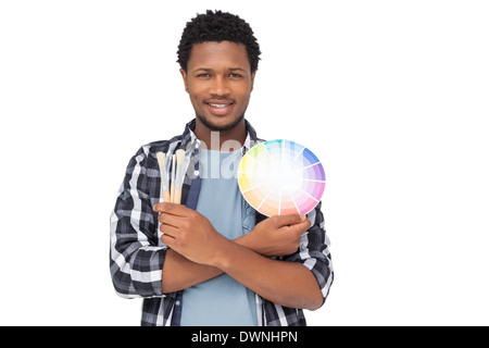 Porträt eines Mannes mit Lackmuster und Pinsel Stockfoto