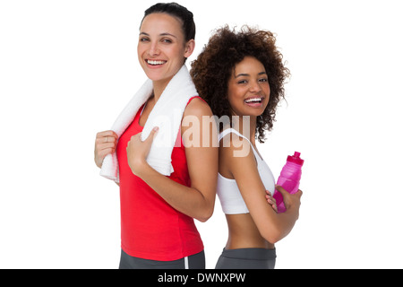 Frauen Sie junge stehen mit Wasserflasche und Handtuch Stockfoto