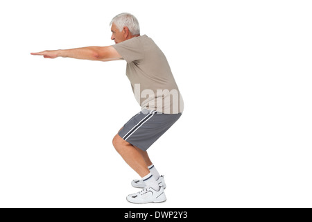 Voller Länge Seitenansicht eines senior Mannes Hände dehnen Stockfoto
