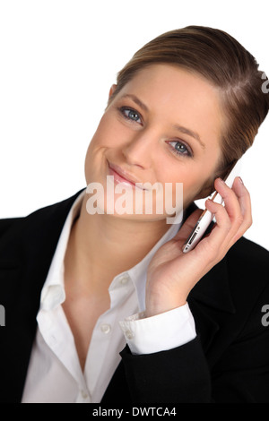 Blonde Frau mit Handy Stockfoto