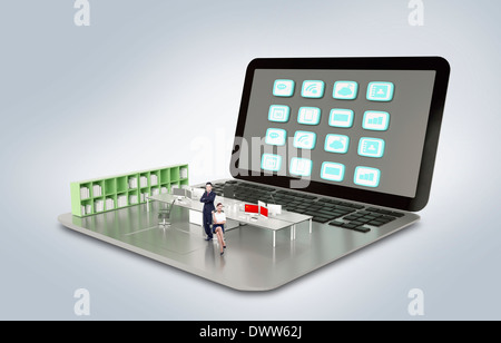 ein Business-Mann stehend auf einem laptop Stockfoto
