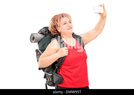 Frau mit Wanderausrüstung, wobei ein Selbstporträt Stockfoto