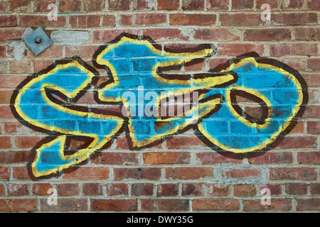 SEO - (Search Engine Optimierung Akronym) Graffiti-Stil Text auf einer alten Mauer grunge Stockfoto