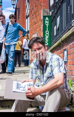 Chester, England - 27. Juni 2012: Chester Künstler John Donnelly arbeiten in Chester auf der Stadt von der Uhr Wände. Stockfoto