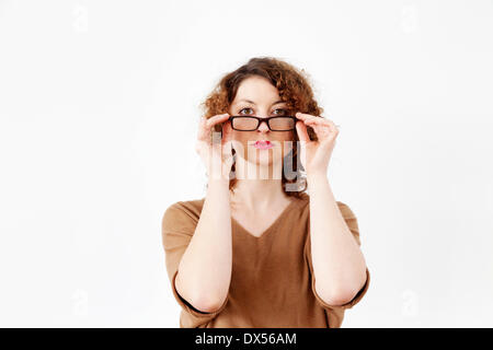 Junge Frau mit Brille Stockfoto