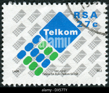 Südafrika - ca. 1991: Briefmarke gedruckt in Südafrika zeigt das Emblem der Telkom, ca. 1991 Stockfoto