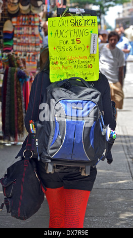 Am enterprising female student in Greenwich Village, New York City offering to draw sketches for a small fee. Stockfoto