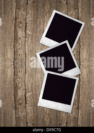 drei alte Bilderrahmen über rustikale Holz Hintergrund Stockfoto
