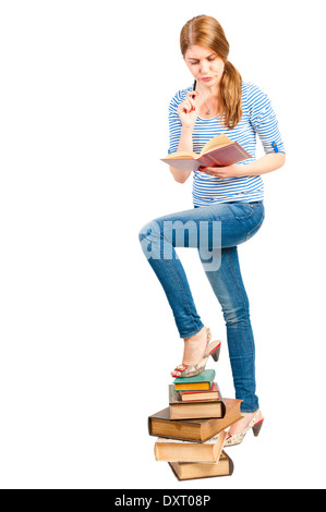 Stapel von Büchern und ein Student im studio Stockfoto