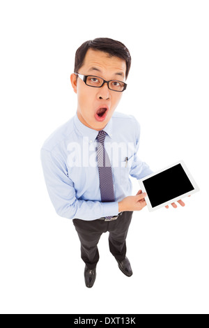 überrascht Geschäftsmann hält eine Tablette Stockfoto