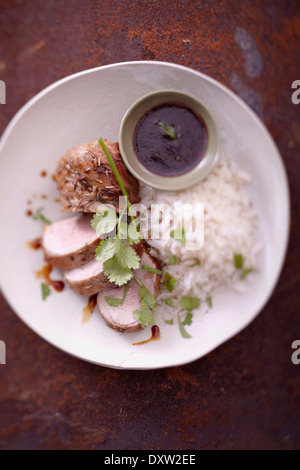 Schweinefleisch Filet Mignon mariniert in Honig und Fenchel Samen, weißer Reis Stockfoto