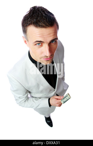 Zuversichtlich Geschäftsmann hält US-Dollar auf einem weißen Hintergrund isoliert Stockfoto