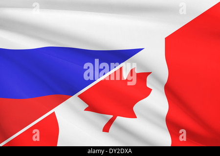 Flagge von Russland und Kanada im Wind wehen. Teil einer Serie. Stockfoto