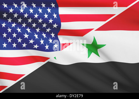 Flaggen der USA und Syrien im Wind wehen. Teil einer Serie. Stockfoto