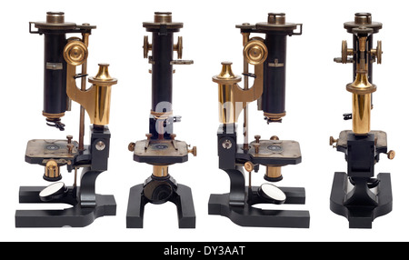 Vier Ansichten von einem frühen Messing antik petrologischen Mikroskop von R. Fuess Berlin, Deutschland, Cut-out-weißer Hintergrund Stockfoto