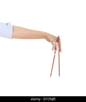 Ess-Stäbchen in der Hand isoliert auf weißem Hintergrund Stockfoto