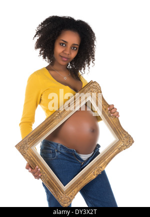 Nachdenklich afrikanische Frau zeigt ihren schwangeren Bauch in einem frame Stockfoto